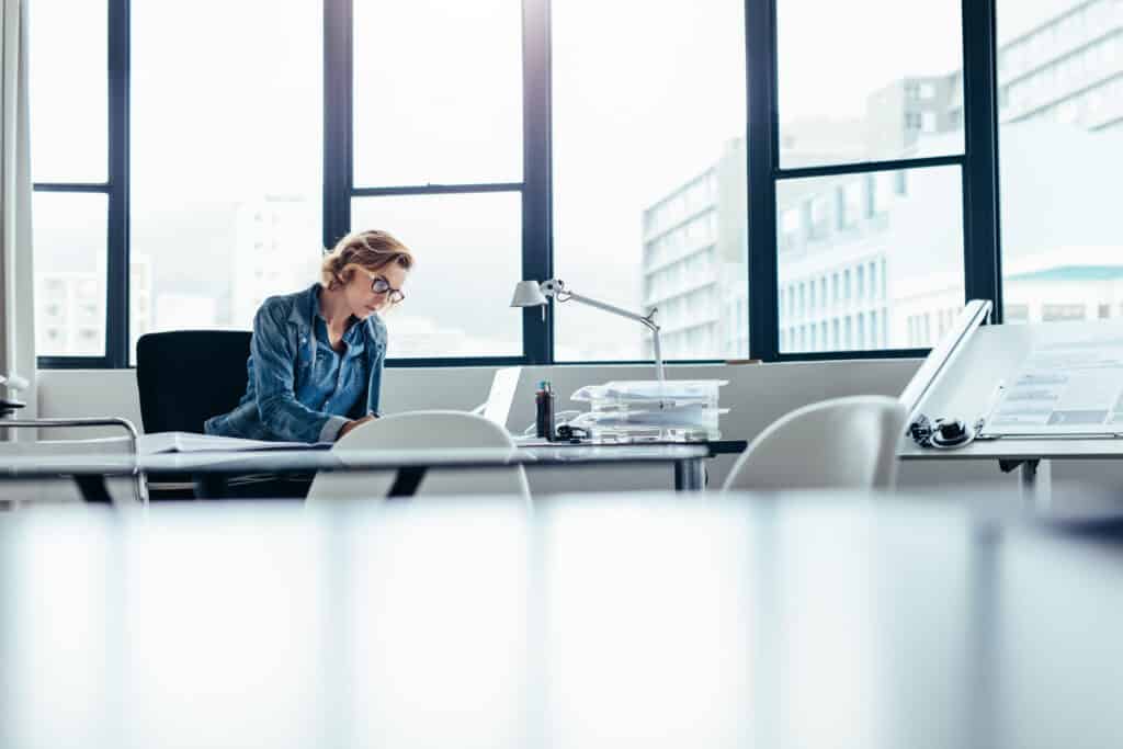 businesswoman looking busy working on laptop